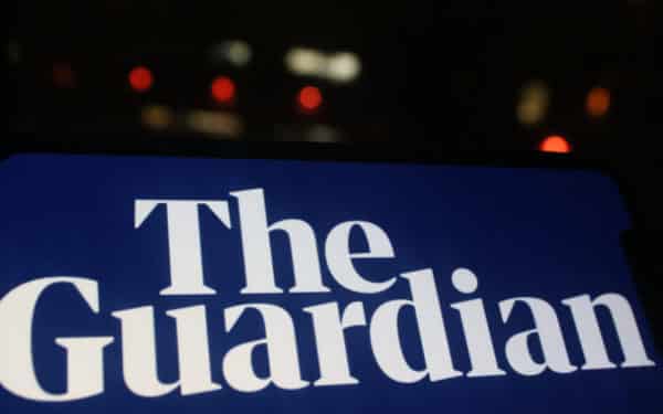 Moscow, Russia - 30 May 2020: Mobile phone screen with the Guardian news logo. The Guardian is British daily newspaper.