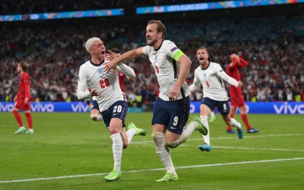 Harry Kane of England is congratulated by Phil Foden after scoring the second goal during the UEFA Euro 2020 Championship Semi-final match between England and Denmark at Wembley Stadium on July 07, 2021 in London, England.