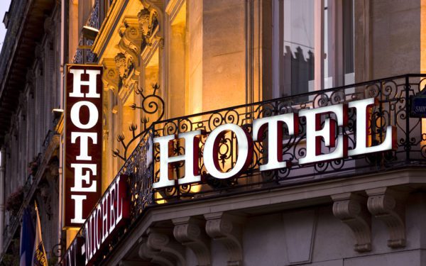 Illuminated Parisian hotel signs