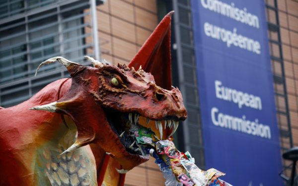 A plastic-spitting dragon is set up in front of the European Commission offices