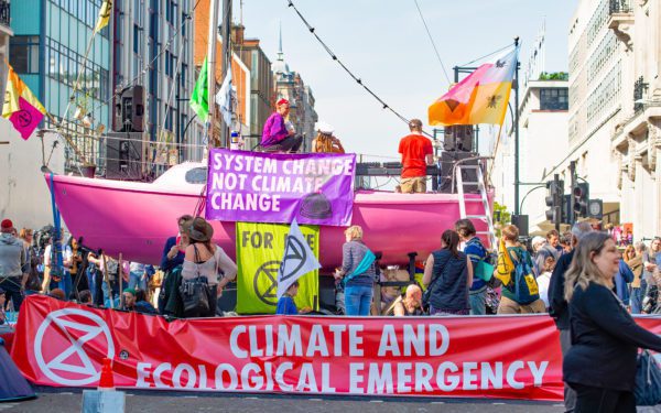 Climate change/eco protesters at the Extinction Rebellion demonstration, at Oxford Circus, London, in protest of world climate breakdown and ecological collapse.
