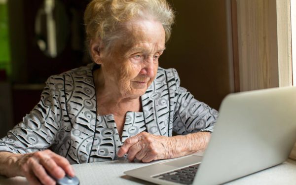 Old woman working on laptop