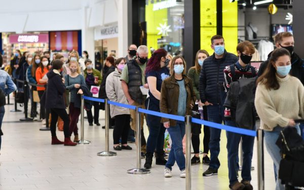 Young people queueing at the walk in Covid vaccination clinic in the Darwin Shopping Centre in Shrewsbury