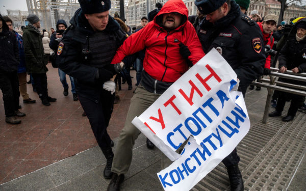 Moscow, Russia. 10 February, 2019: People take part in Mothers' Anger March, an event in support of political prisoners, in Tverskoy Boulevard of Moscow. Police officers detain a protester during a rally to demand freedom for political prisoners, Russian protest