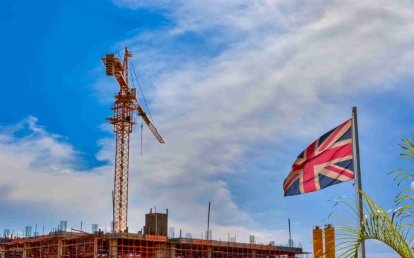 England flag, construction site, developments before Brexit