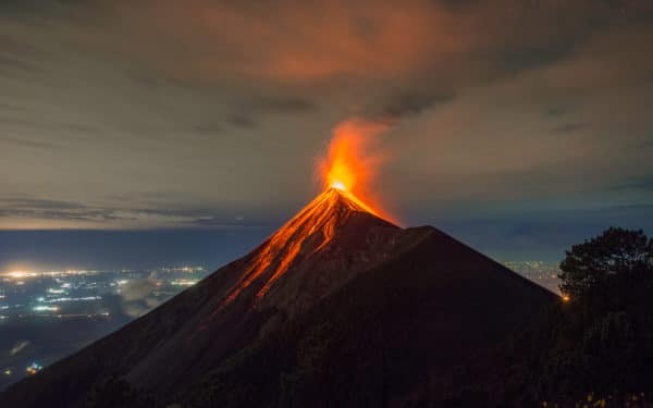 Erupting Volcan de Fuego in Guatemala at night. One of the most active volcanos in Central America. You can see lava all year long.