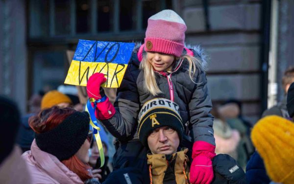 No war. Young girl holding a sign at protest against Ukraine war in Helsinki, Finland.