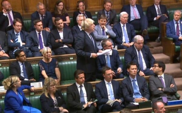 Boris Johnson giving a statement to the House of Commons from the backbenches.