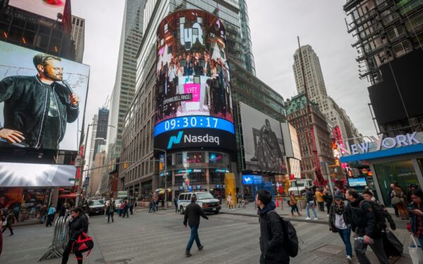 Nasdaq stock exchange in Times Square, New York. (via Shutterstock/ rblfmr)
