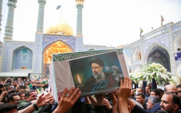 . Iranian mourners attend the funeral procession of Iran's President Ebrahim Raisi in Qom.