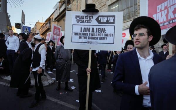 Ultra-Orthodox Jewish men attend a rally against army recruitment in Jerusalem on Sunday, June 30, 2024. Israel's Supreme Court last week ordered the government to begin drafting ultra-Orthodox men into the army,