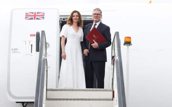 Stansted, Prime Minister Keir Starmer and his wife Victoria Starmer pose for a photograph as they board the plane to head to the NATO Summit in Washington D.C. (No 10 Downing Street via Flickr)