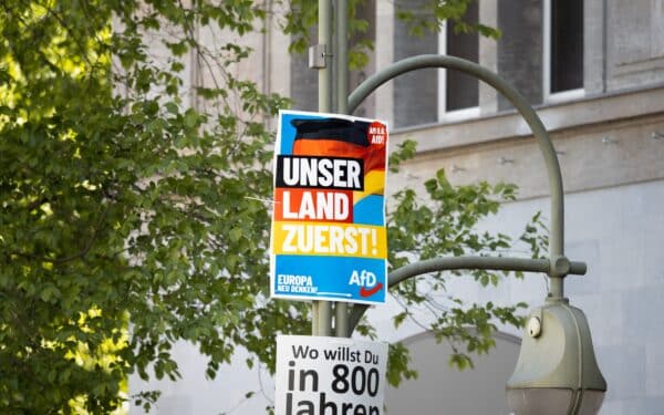 "Our Land First" AfD election campaign poster on a street lamp to advertise for the European elections in 2024 (Felix Geringswald via Shutterstock)