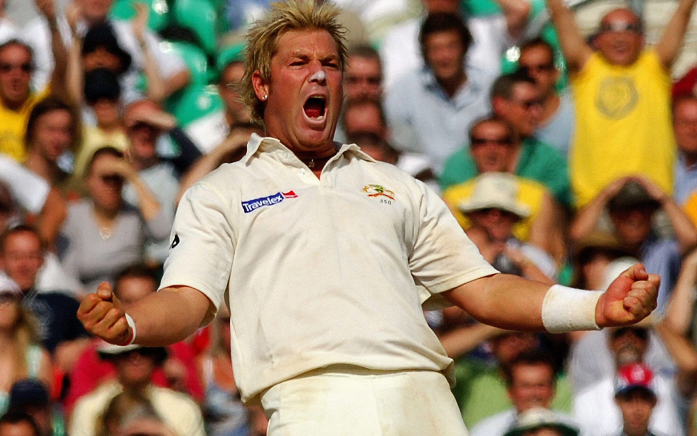 Australia's Shane Warne celebrates after he caught and bowled England's Andrew Flintoff for 8 runs during the final day of the fifth npower Test match at the Brit Oval, London.