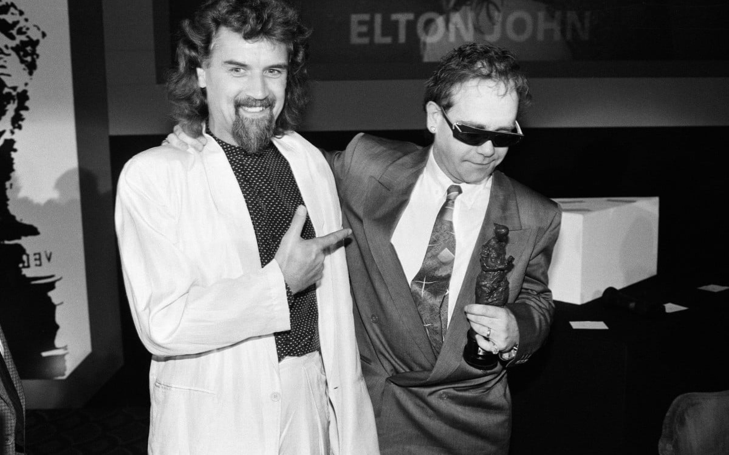 The Ivor Novello Awards at Gorsvenor House, London. Pictured, Billy Connolly and Elton John. 7th April 1986.