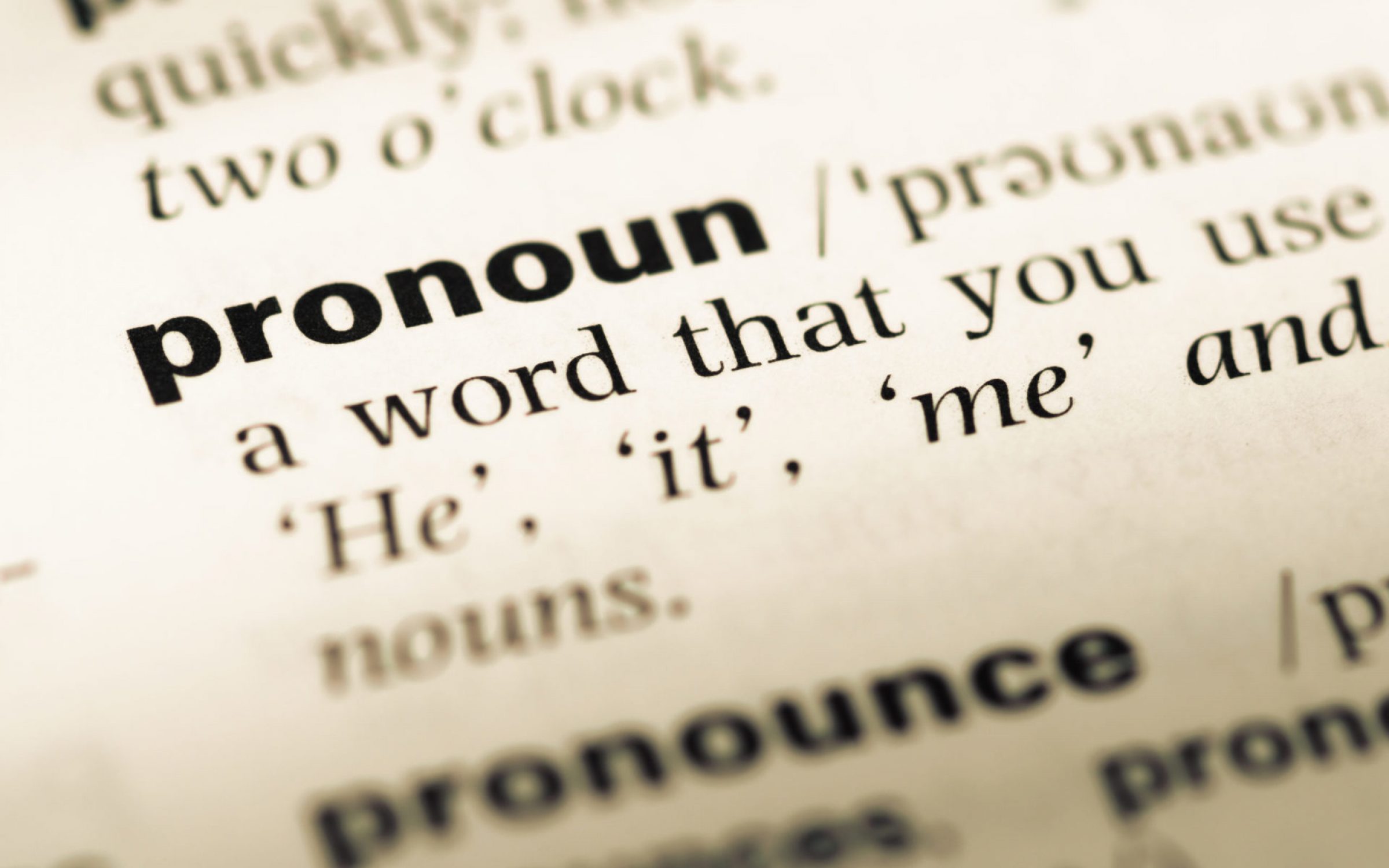 old dictionary page with the word pronoun