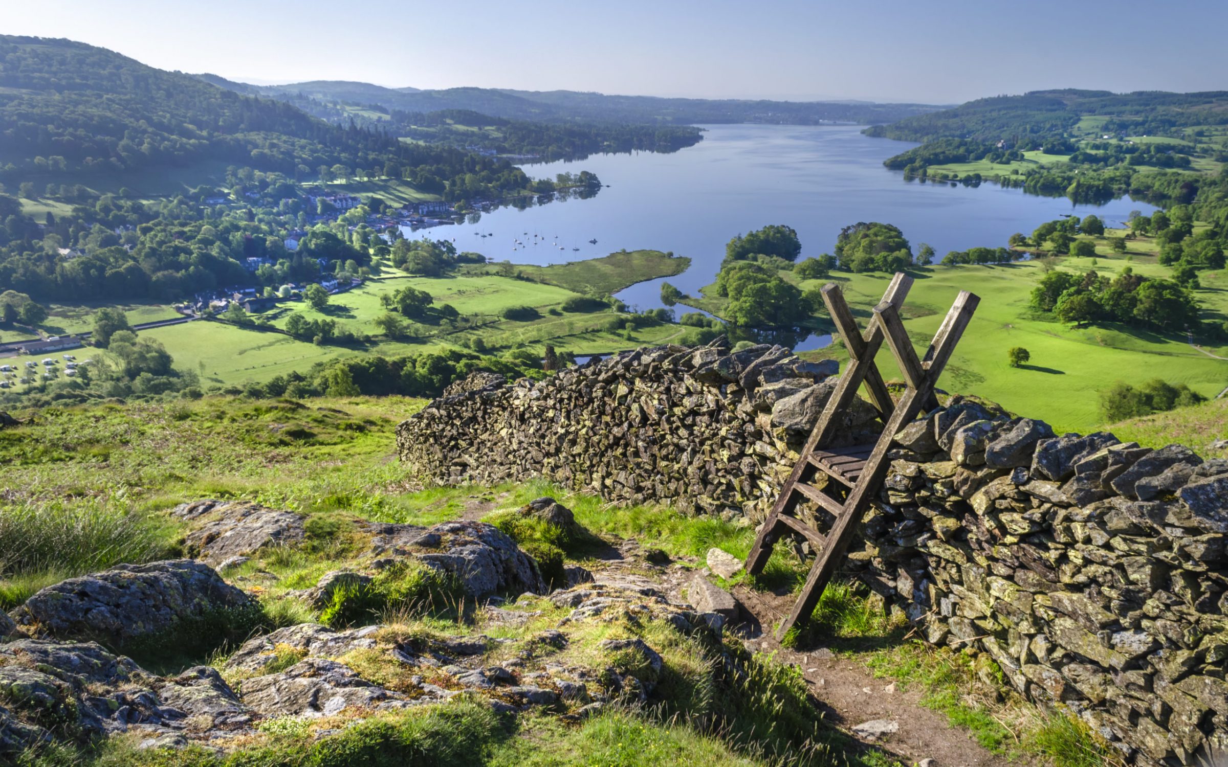 A morning shot of Lake Windermere showing the stone walling and the stile providing passage over the wall.