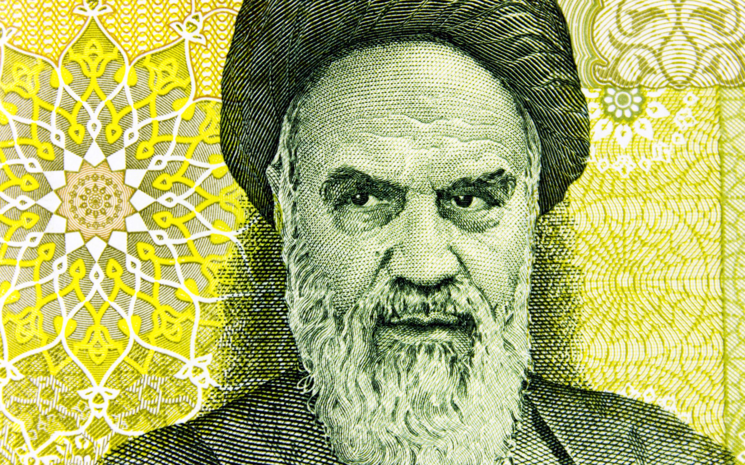 Portrait of Ayatollah Khomeini close-up on banknote 100 000 Iranian rials.