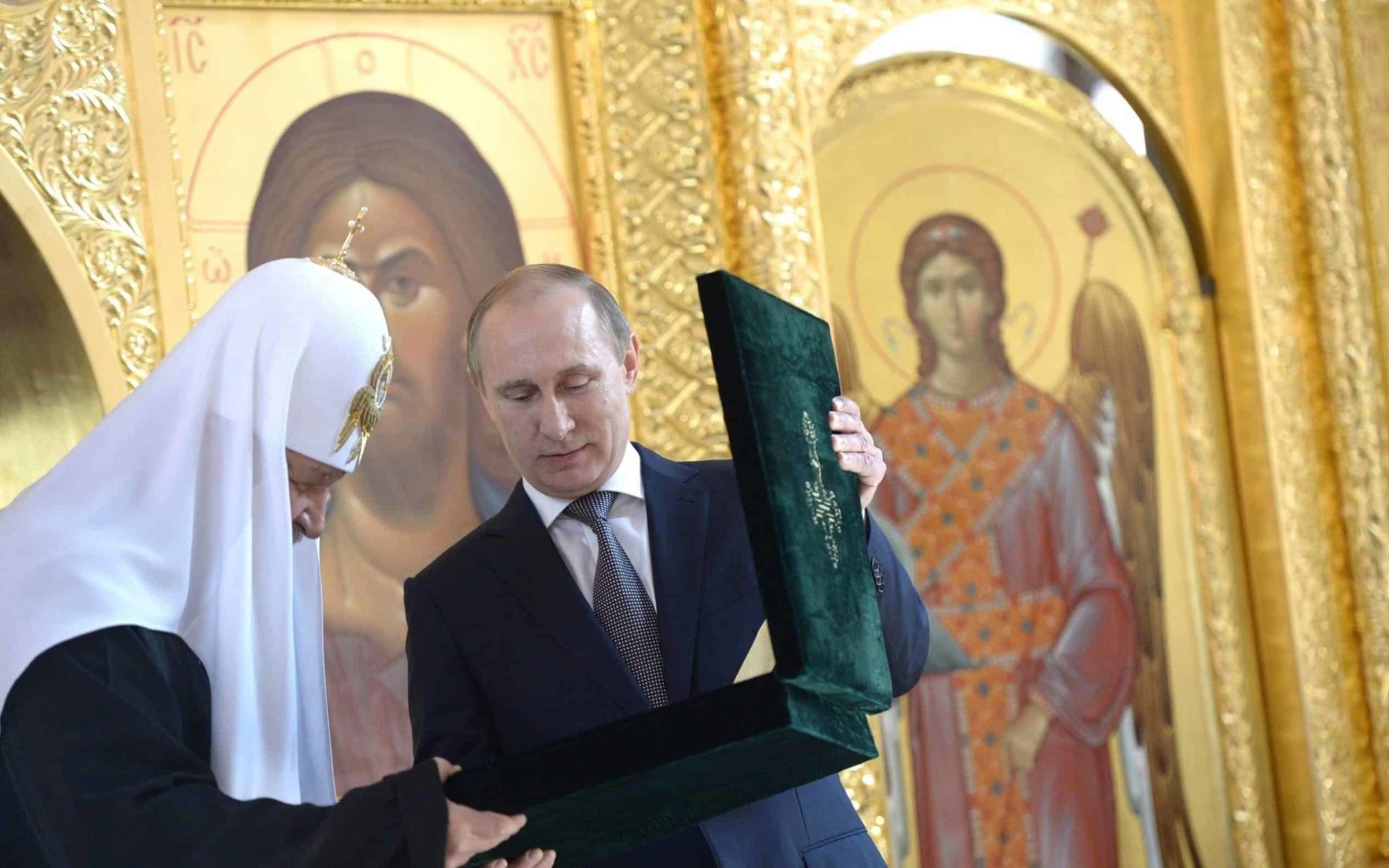 Russian President Vladimir Putin presents Patriarch of Moscow and All Russia Kirill with a Mother of God icon during a visit to the newly restored Church of St Vladimir at the Moscow Diocesan House to mark 1000 years since the death of St. Vladimir July 27, 2015 in Moscow, Russia.