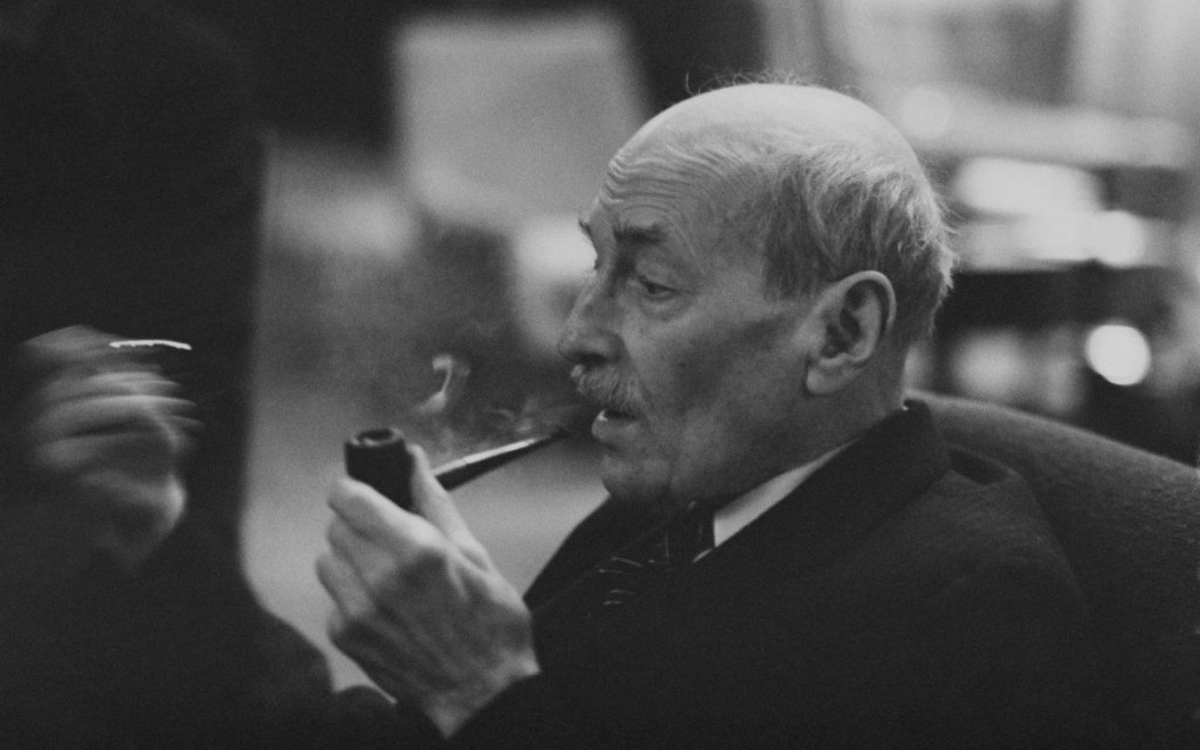 English Labour Party politician and former Prime Minister of the United Kingdom, Clement Attlee (1883-1967) pictured lighting a pipe as he celebrates his 80th birthday at the Western Hotel in Paddington, London on 3rd January 1963