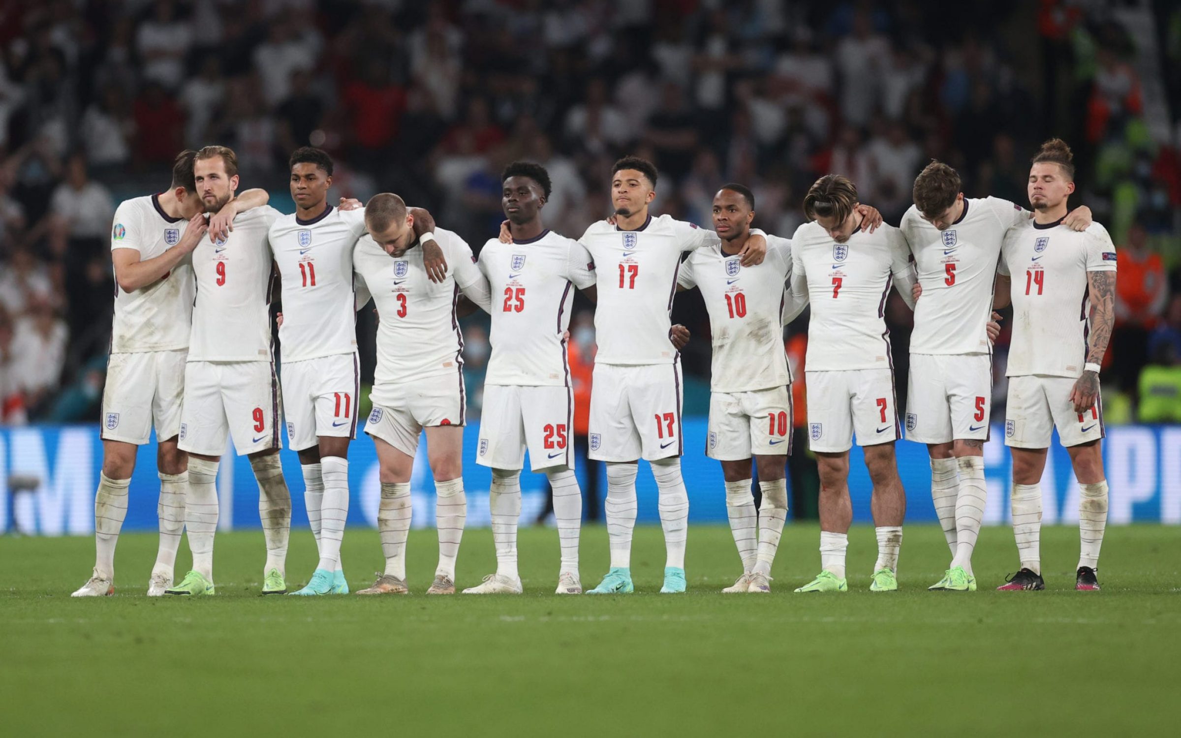 The England football team stand side by side during their penalty shootout with Italy in the Euro 2020 final