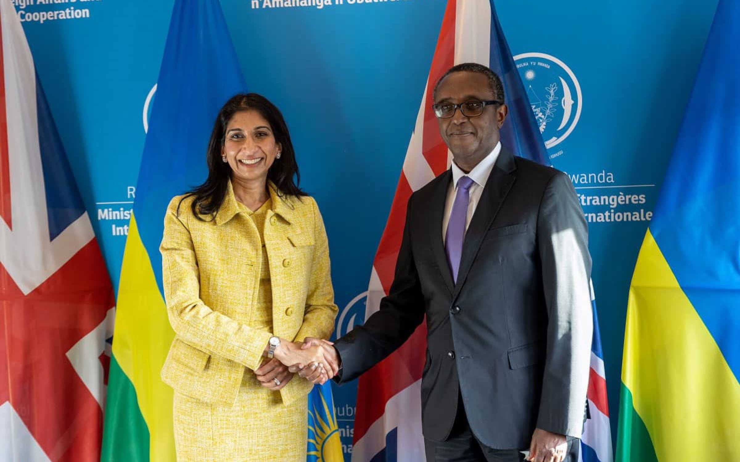 Home Secretary Suella Braverman shaking hands with with Rwandan Minister for Foreign Affairs and International Co-operation, Dr. Vincent Biruta after signing an expansion of the Migration and Economic Development Partnership.jpg