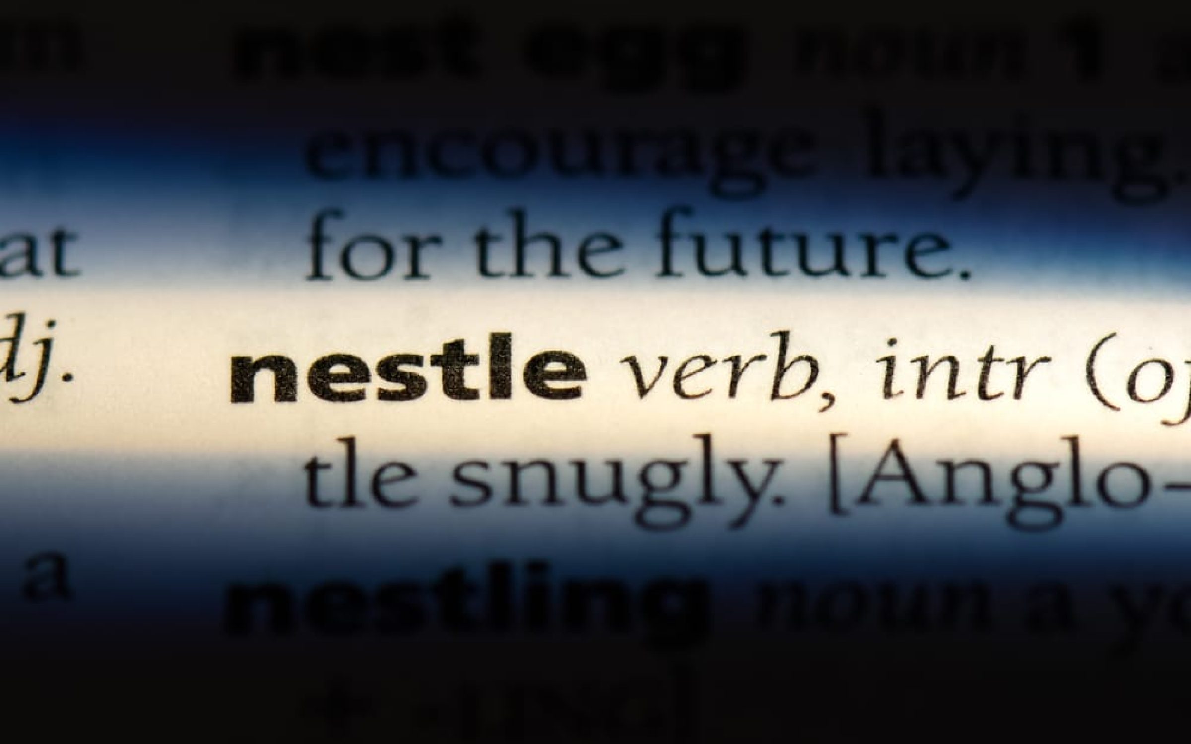 "to nestle", in the English dictionary