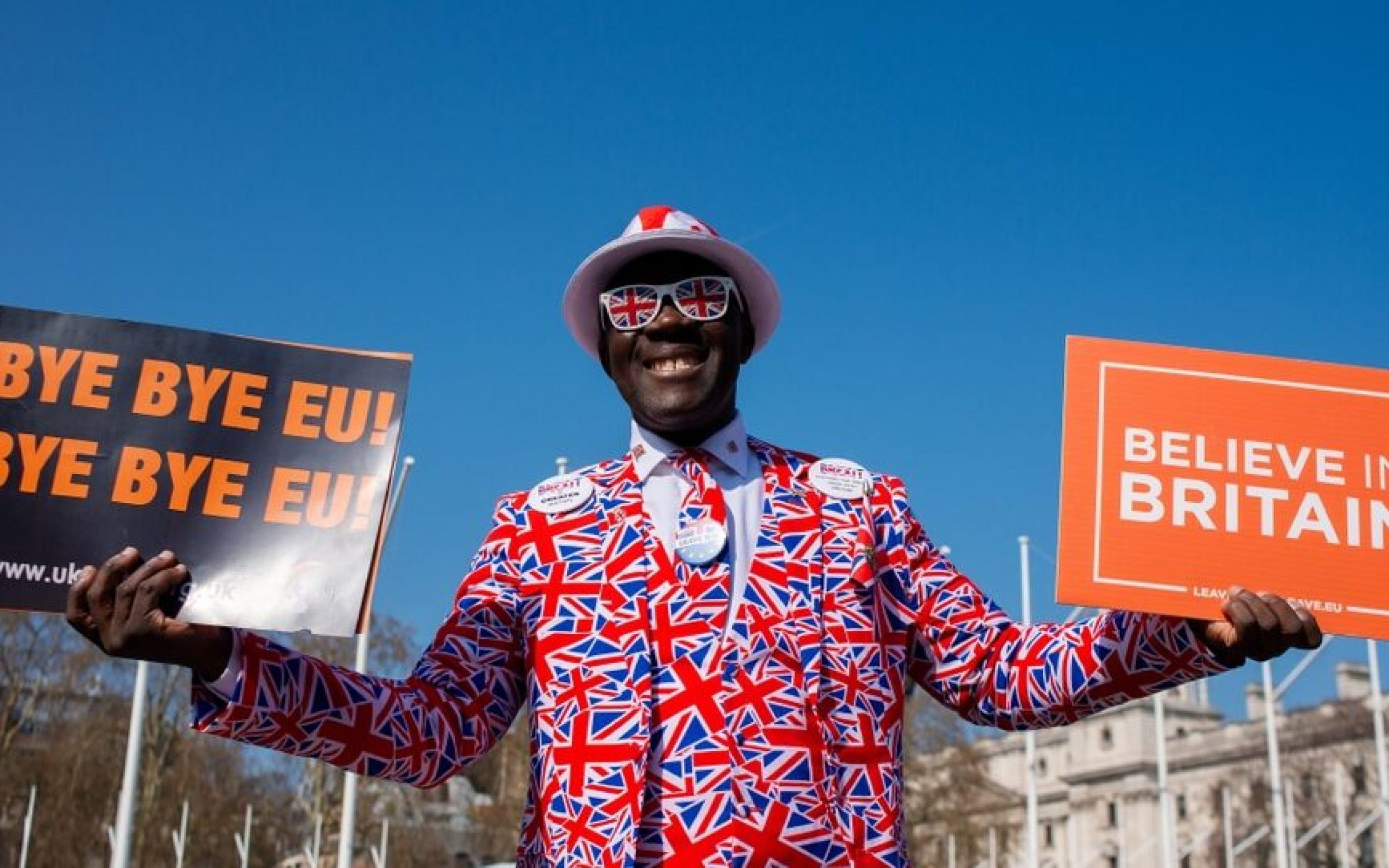 London, UK. 29th March 2019. Pro-Brexit supporter, Joseph Afrane, dressed in a patriotic Union Jack three piece suit, at the March To Leave demonstration rally held at Parliament Square, London, UK.
