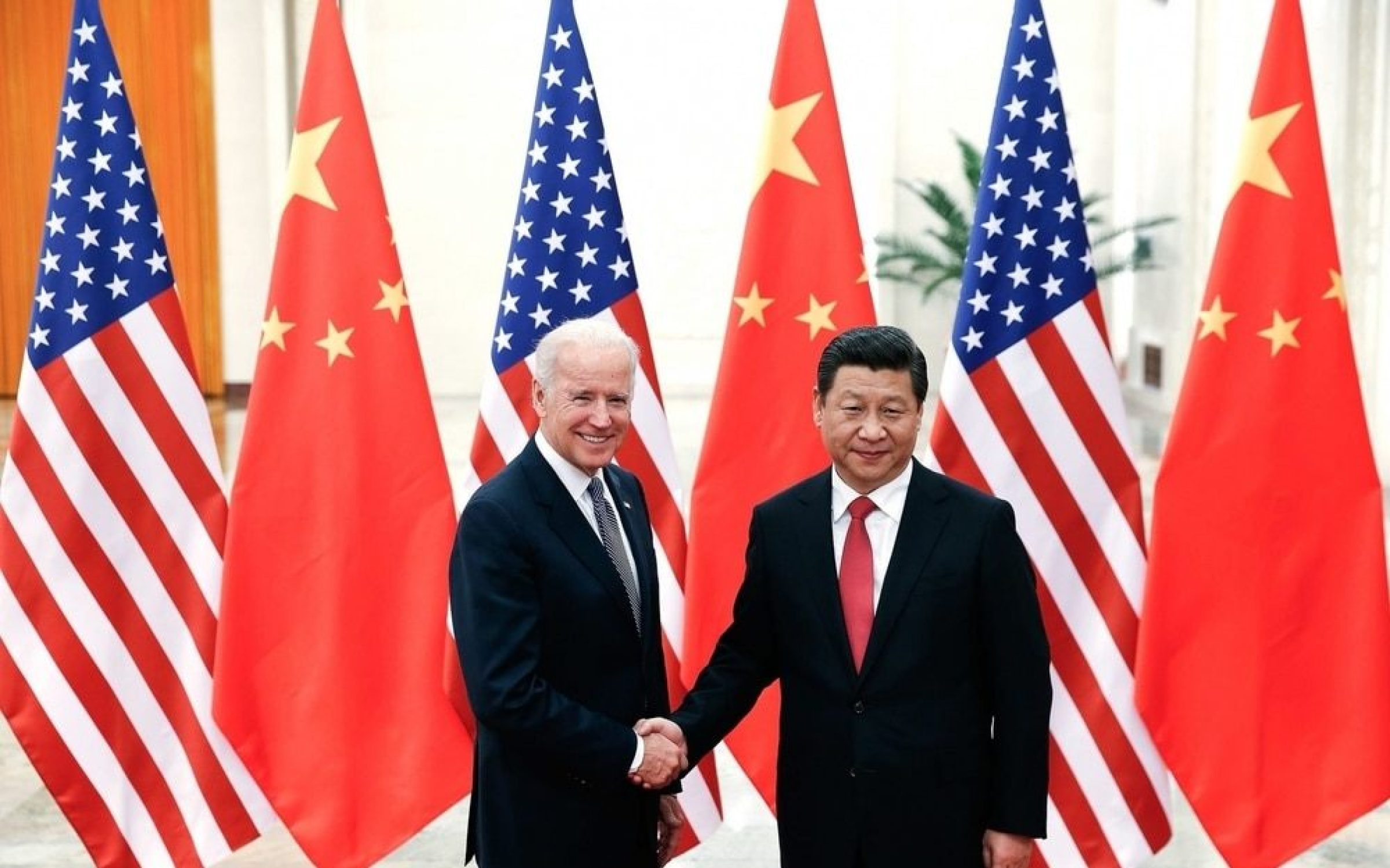 Chinese President Xi Jinping shake hands with then US Vice President Joe Biden inside the Great Hall of the People on December 4, 2013 in Beijing, China.