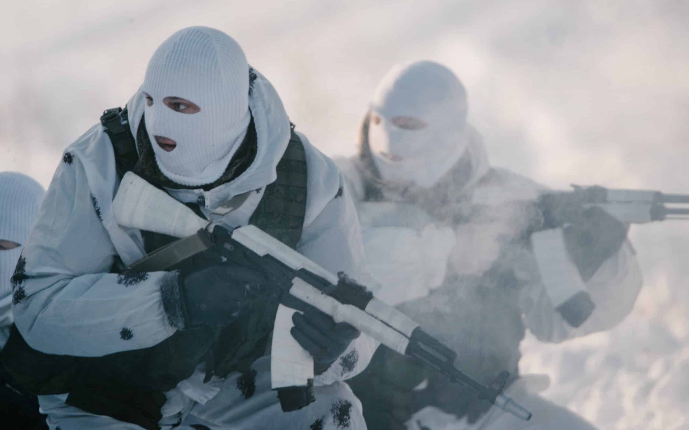 Russian troops during a winter war game (knyazevfoto via shutterstock)